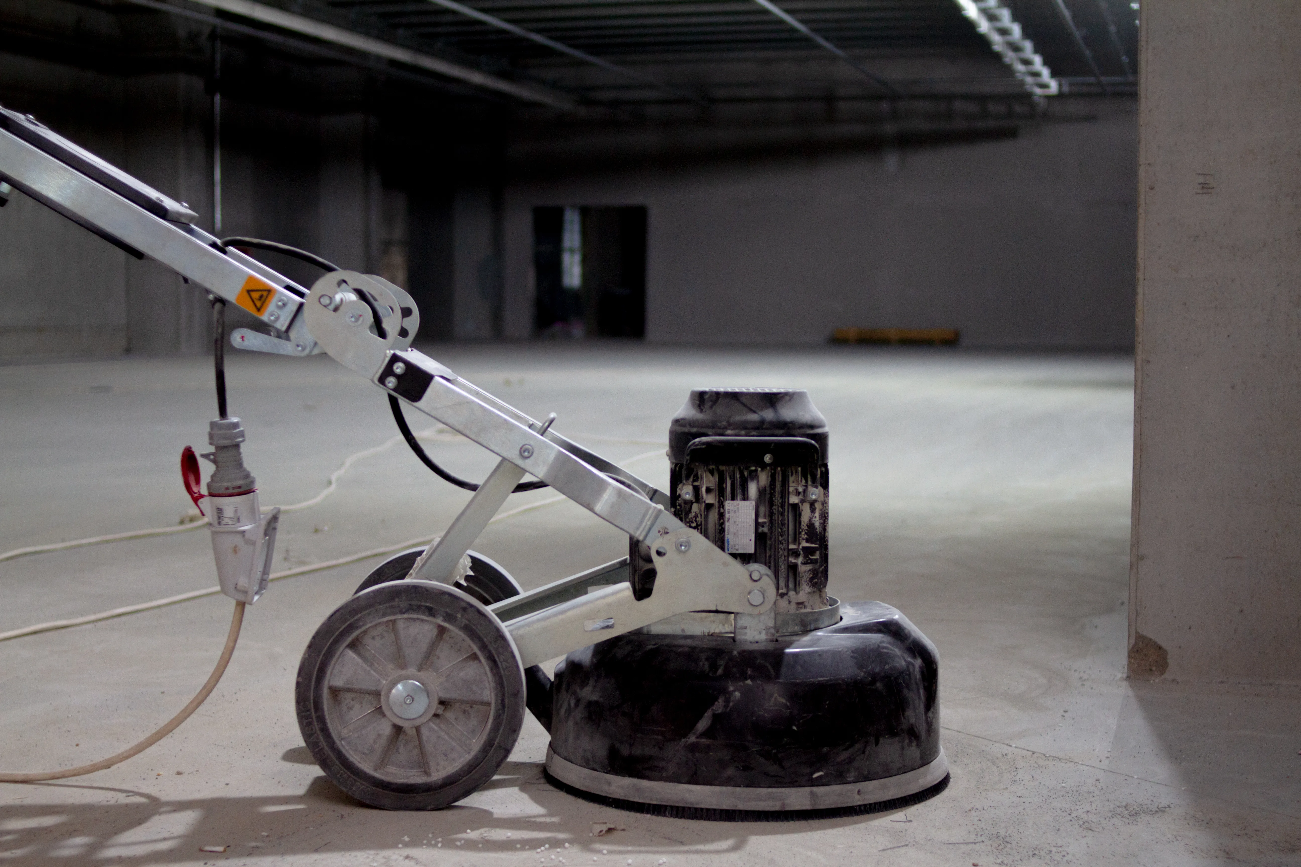 Industrial floor grinder preparing concrete slab for epoxy resurfacing Vancouver