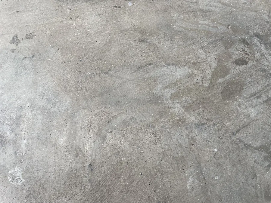 Close-up of a diamond-ground concrete slab surface in Vancouver BC — showing the grinding pattern and surface texture required before epoxy coating